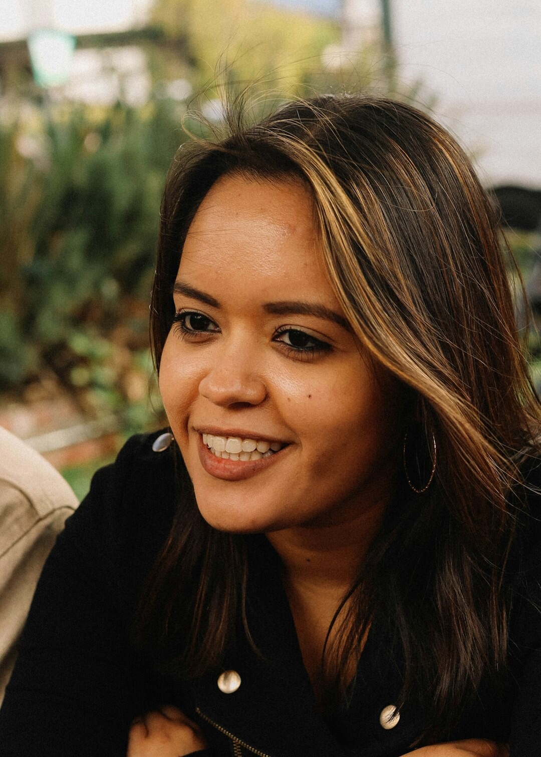 Professional headshot of a young Latina female developer