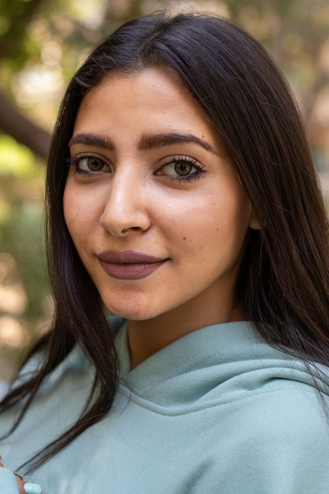 Professional headshot of a Latina female programming instructor