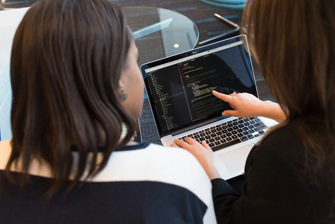 students coding together