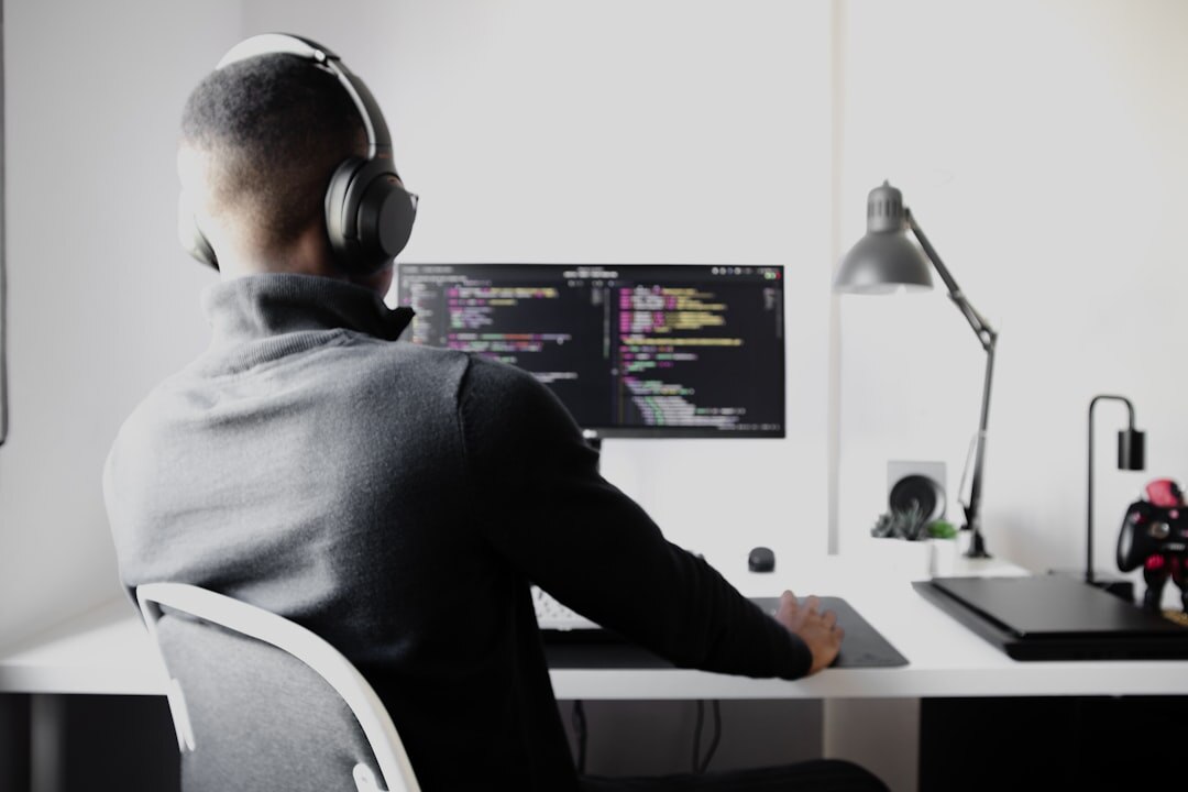 beginner programmer at desk coding