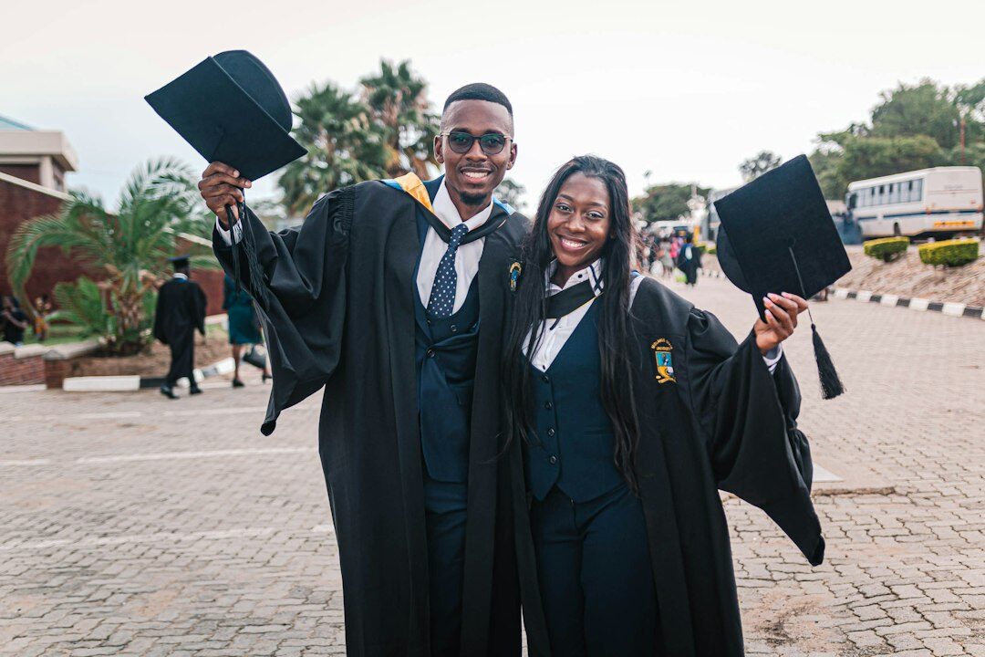 graduates celebrating coding achievement