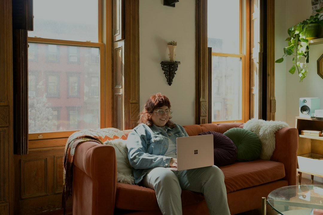 person coding on laptop at home