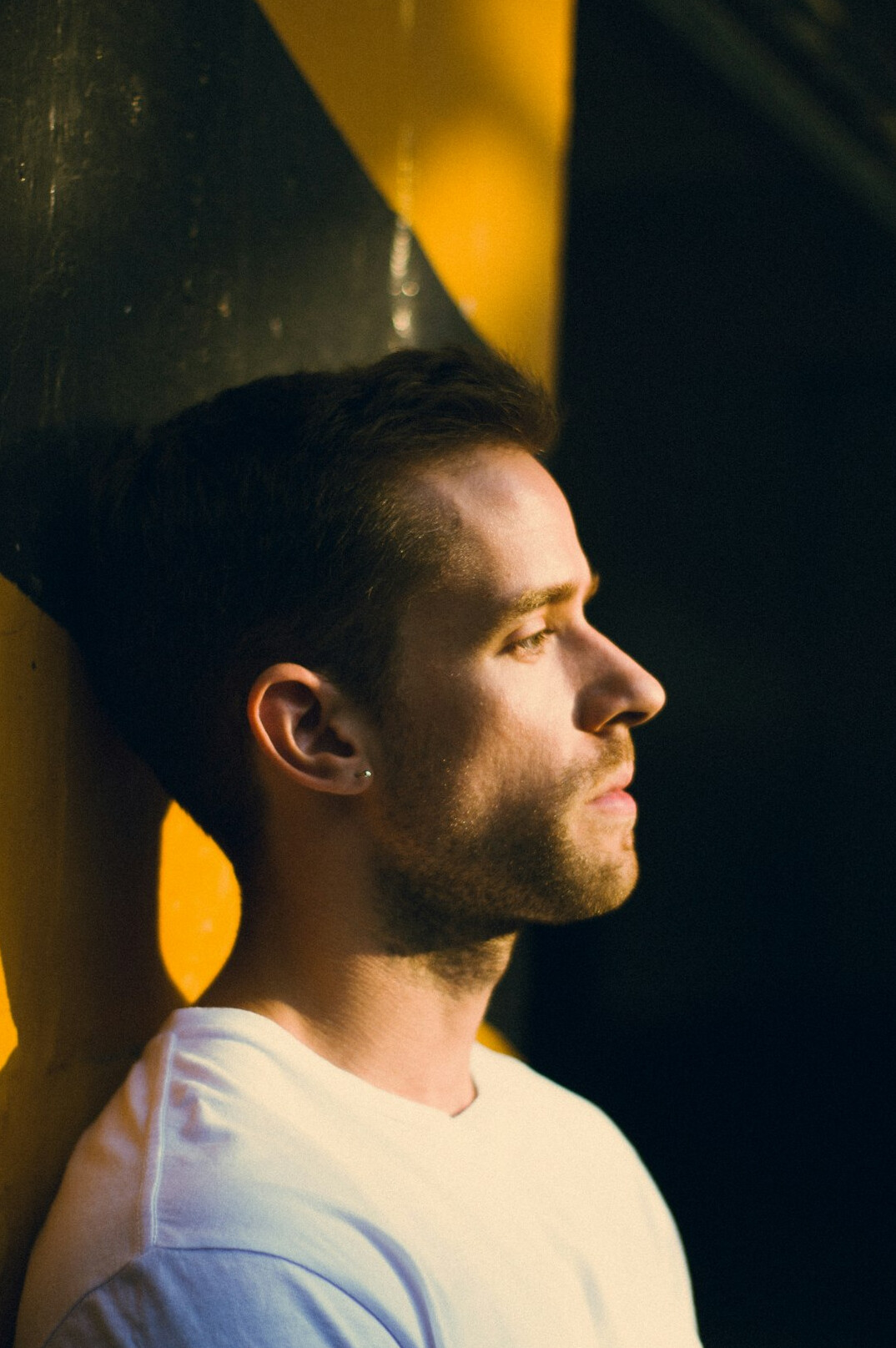 Portrait of a man with short hair and light stubble